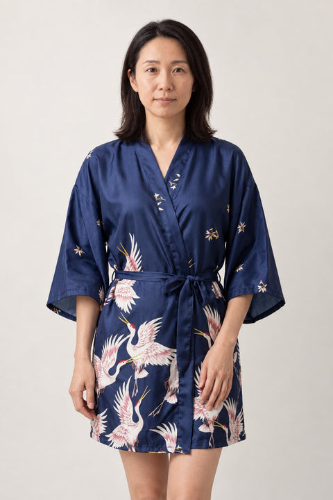 Navy Crane Short Kimono Robe 'Sorazuru' – navy women's short satin-look kimono robe with pink crane print and tie belt, Japanese dressing gown, front view on model