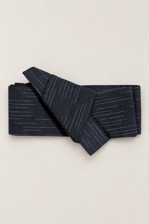 Navy Fabric Obi Belt 'Hoshikage' – navy obi belt with broken white streaks, narrow pre-tied Japanese obi belt with sewn knot and hidden adjustable closure, for kimono, yukata or jinbei, studio view