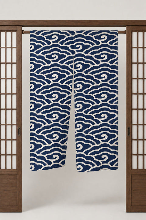 Navy Scroll Wave Noren 'Makinami' – navy noren with seigaiha wave pattern in white scrolling arcs, split Japanese noren door curtain hung on a rod between sliding screens, studio view