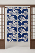 Ocean Wave Japanese Door Curtain 'Oonami' – deep blue noren with round curling waves and white spray, split Japanese noren door curtain hung on a rod between sliding screens, studio view
