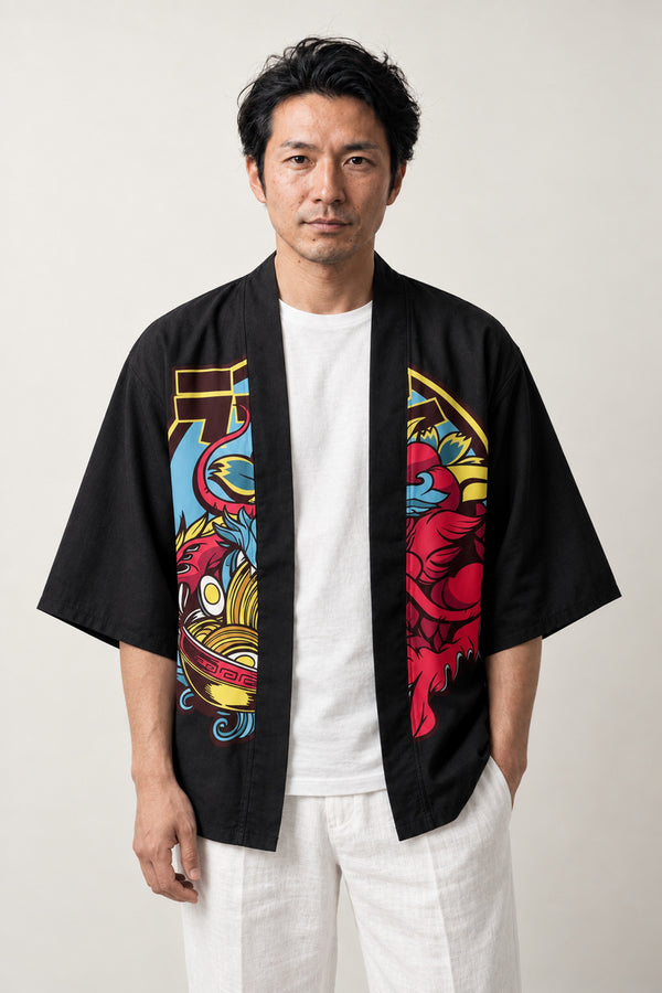 Oni Black Haori Jacket 'Kimon' – black haori jacket with colourful oni demon mask and torii gate print, unisex Japanese kimono style cardigan, front view on model
