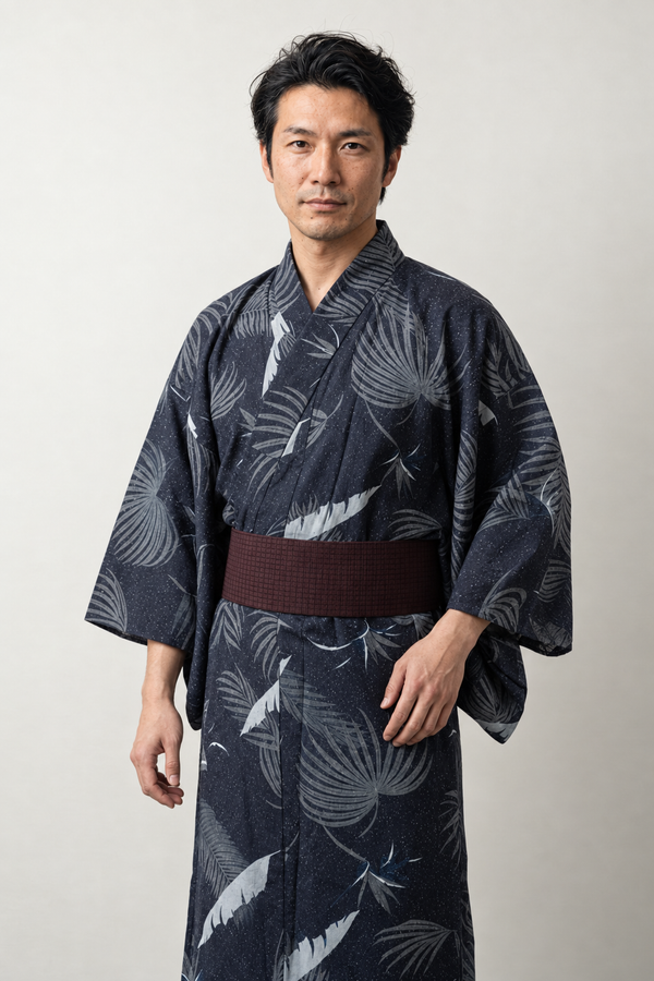 Palm Leaf Yukata 'Shuro' – navy men's yukata with tonal palm leaf print and dark red obi belt, Japanese kimono robe, front view on model