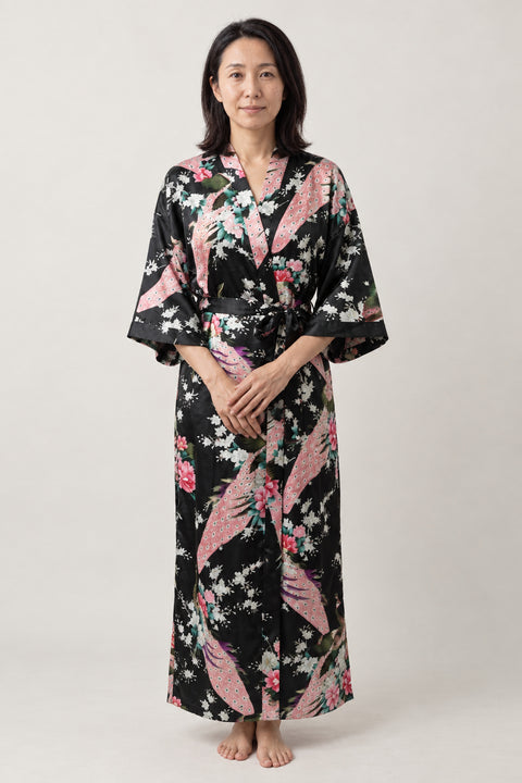 Peacock and Peony Dressing Gown 'Kuroshou' – black women's long satin-look kimono dressing gown with peacock and peony print, Japanese robe, front view on model