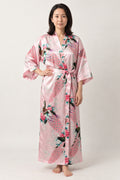 Pink Peacock Long Kimono Robe 'Momoshou' – pink women's long satin-look kimono robe with peacock and blossom print, Japanese dressing gown, front view on model