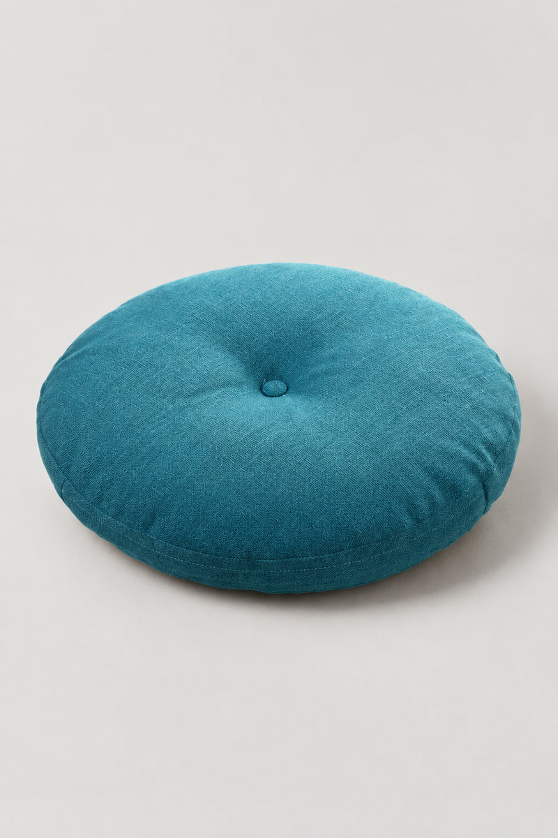Plain Round Zabuton Cushion 'Marumuji' – turquoise plain round floor cushion with centre button, Japanese zabuton floor cushion, studio view
