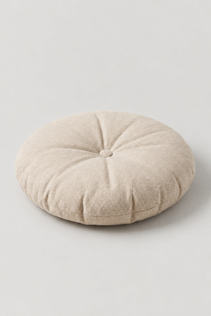 Plain Round Zabuton Cushion 'Marumuji' – beige plain round floor cushion with centre button, Japanese zabuton floor cushion, studio view