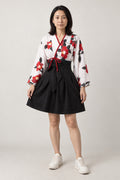 Pleated Kimono Mini Dress Set 'Wabisuke' – white kimono style top with red camellia print and black pleated mini skirt, Japanese two-piece dress set, front view on model