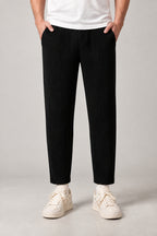Pleated Straight Leg Trousers 'Hida' – black pleated straight leg trousers, front view on model