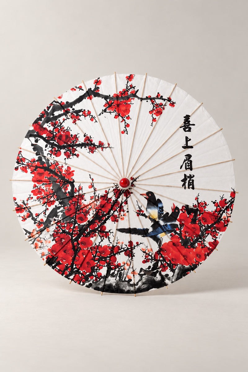 Plum Blossom Paper Umbrella 'Umezono' – white parasol printed with red plum blossom, a magpie and brushed calligraphy, Japanese wagasa parasol with wooden frame and paper-effect canopy, open, studio view