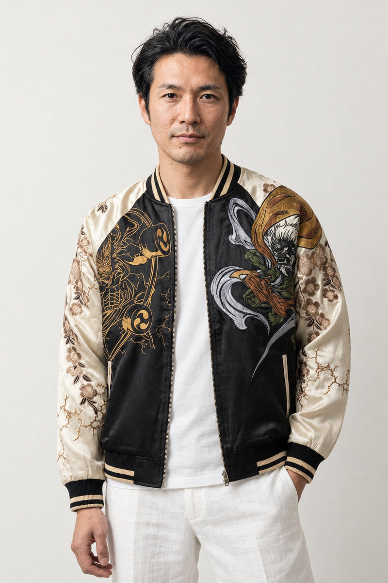 Raijin Thunder God Sukajan 'Raiko' – black and cream sukajan with embroidered Raijin thunder god and drums, Japanese sukajan souvenir bomber jacket, front view on model