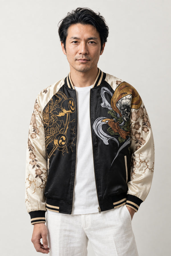 Raijin Thunder God Sukajan 'Raiko' – black and cream sukajan with embroidered Raijin thunder god and drums, Japanese sukajan souvenir bomber jacket, front view on model