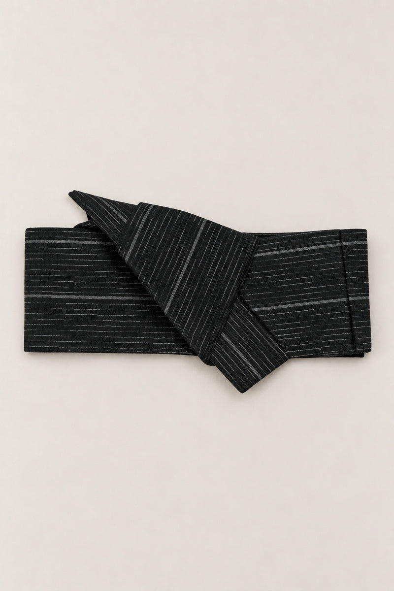 Rain Streak Obi Wrap Belt 'Harusame' – black obi belt with grey rain streak pattern, narrow pre-tied Japanese obi belt with sewn knot and hidden adjustable closure, for kimono, yukata or jinbei, studio view