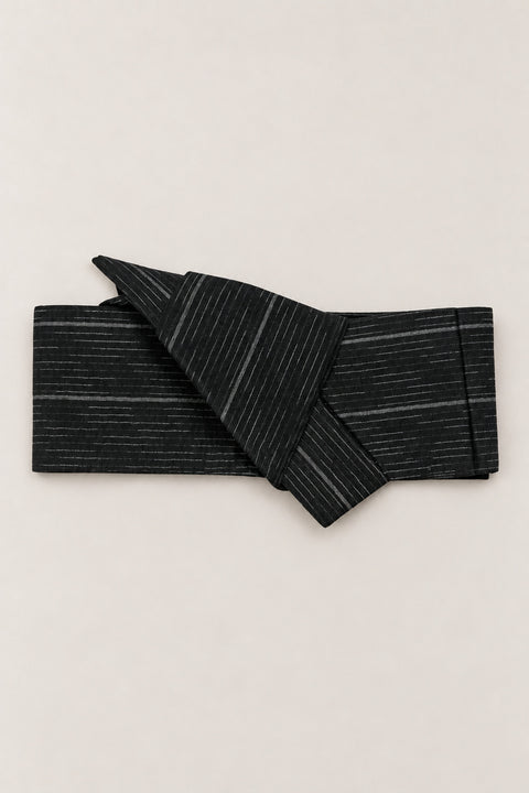 Rain Streak Obi Wrap Belt 'Harusame' – black obi belt with grey rain streak pattern, narrow pre-tied Japanese obi belt with sewn knot and hidden adjustable closure, for kimono, yukata or jinbei, studio view
