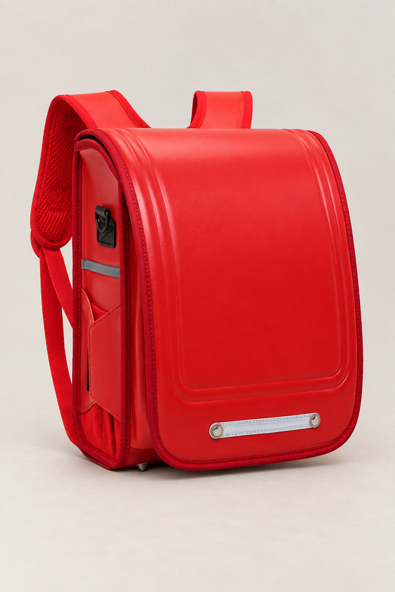 Randoseru – red randoseru Japanese school backpack, front view, studio