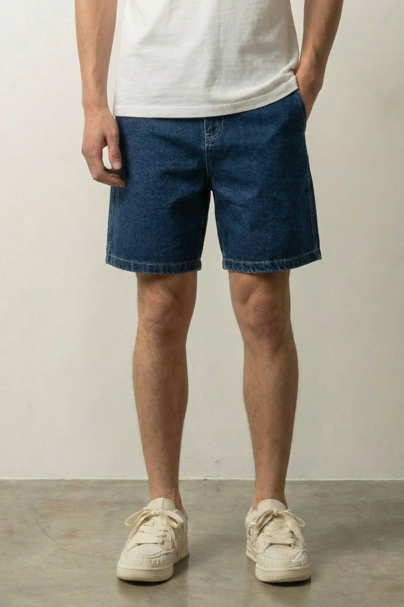 Raw Mid Blue Denim Shorts 'Kiji' – raw mid blue carpenter style denim shorts with patch pockets, front view on model, studio