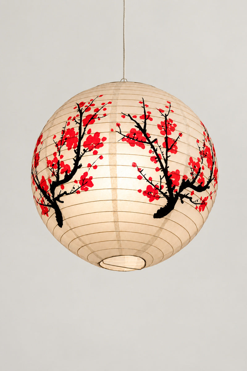 Red Blossom Round Paper Lantern 'Umeakari' – round cream paper lantern printed with red plum blossom on black branches, hanging Japanese lantern shade, studio view