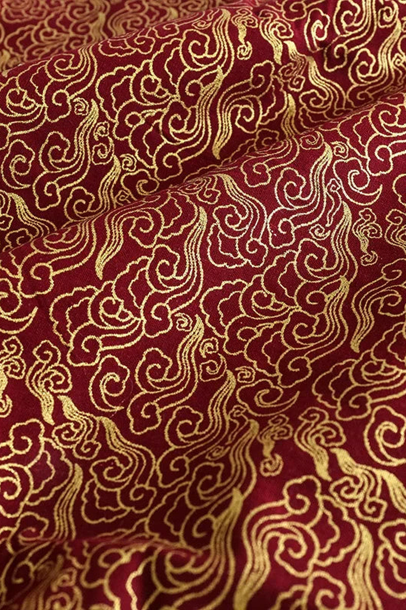 Red Cloud Furoshiki Wrap 'Akagumo' – dark red furoshiki printed all over with swirling clouds in fine gold lines, Japanese furoshiki wrapping cloth 50 by 145 cm, close-up of the print