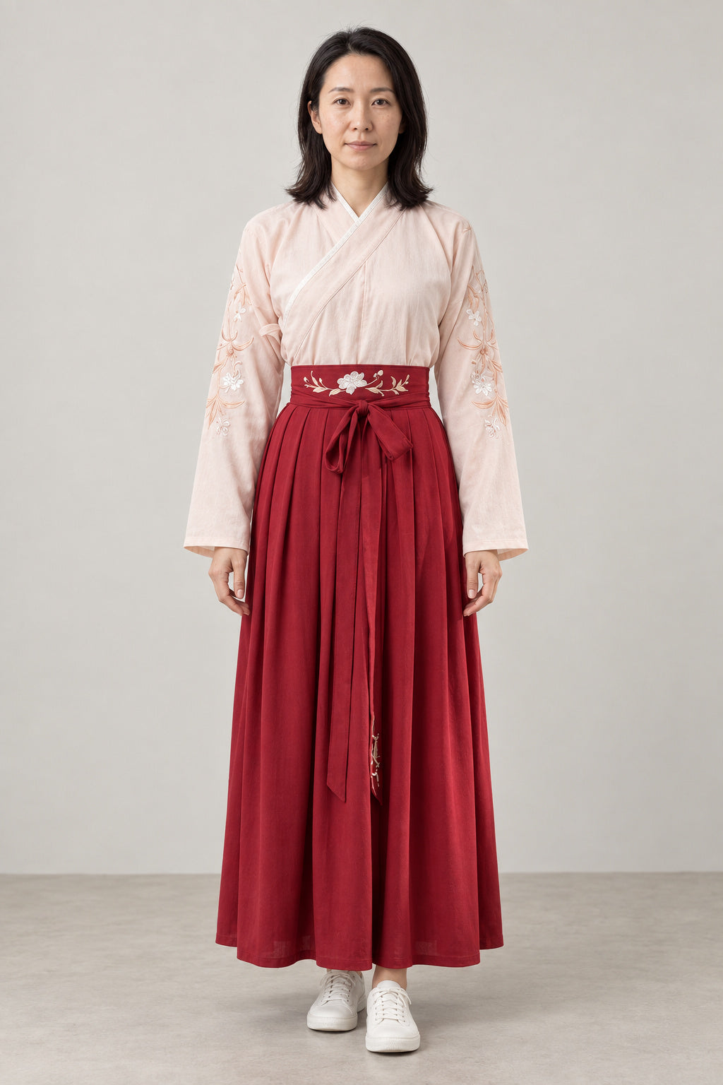 Red Hakama Style Two-Piece 'Suou' – cream embroidered kimono top and red hakama style pleated skirt with sash, Japanese two-piece outfit, front view on model