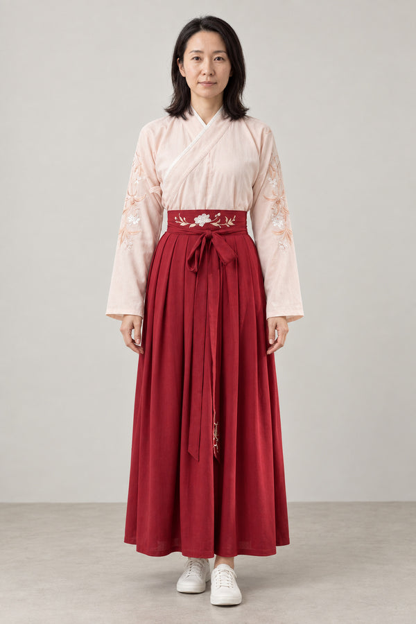 Red Hakama Style Two-Piece 'Suou' – cream embroidered kimono top and red hakama style pleated skirt with sash, Japanese two-piece outfit, front view on model