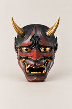 Red Hannya Mask 'Shakki' – red painted resin hannya mask with gold horns, gold eyes and gold teeth, Japanese Noh demon mask, studio view