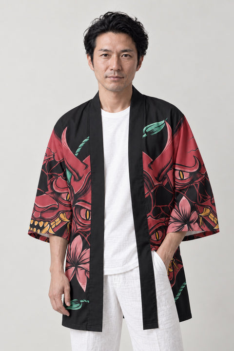 Red Oni Happi Jacket 'Shimenawa' – black happi jacket with red oni demon mask and blossom print, Japanese happi coat, unisex festival jacket, front view on model