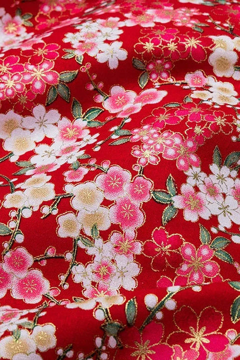 Red Sakura Furoshiki Wrap 'Benizakura' – red furoshiki printed with cherry blossom massed edge to edge in pink, white and gold, Japanese furoshiki wrapping cloth 50 by 145 cm, close-up of the print