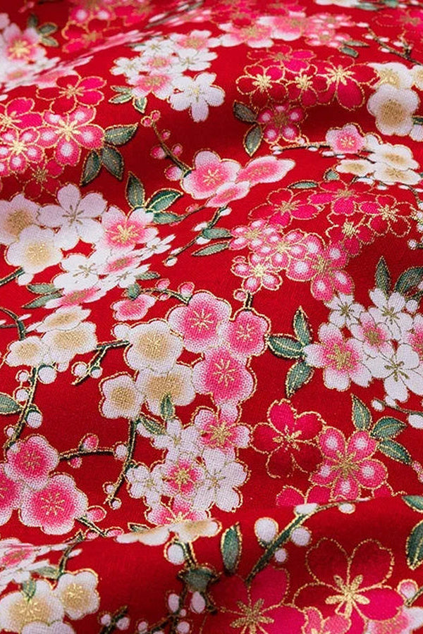Red Sakura Furoshiki Wrap 'Benizakura' – red furoshiki printed with cherry blossom massed edge to edge in pink, white and gold, Japanese furoshiki wrapping cloth 50 by 145 cm, close-up of the print