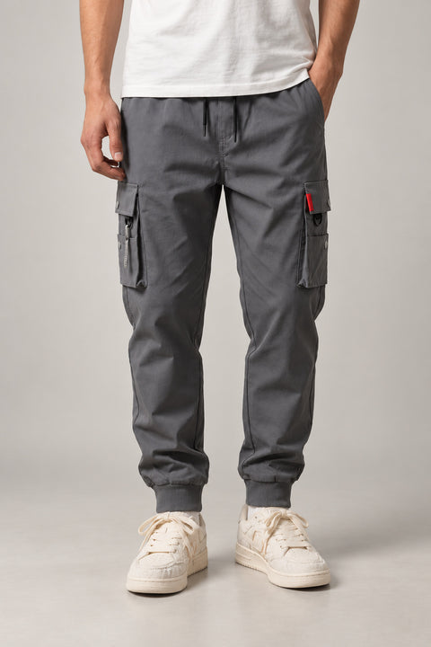 Red Seam Cargo Joggers 'Hitosuji' – grey cargo joggers with red seam detail and cuffed hem, Japanese streetwear trousers, front view on model