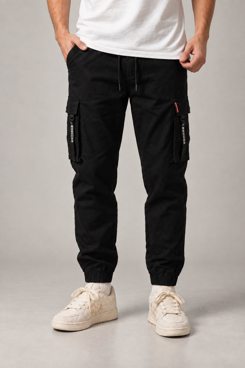 Red Seam Cargo Joggers 'Hitosuji' – black version of the red seam cargo joggers, front view on model