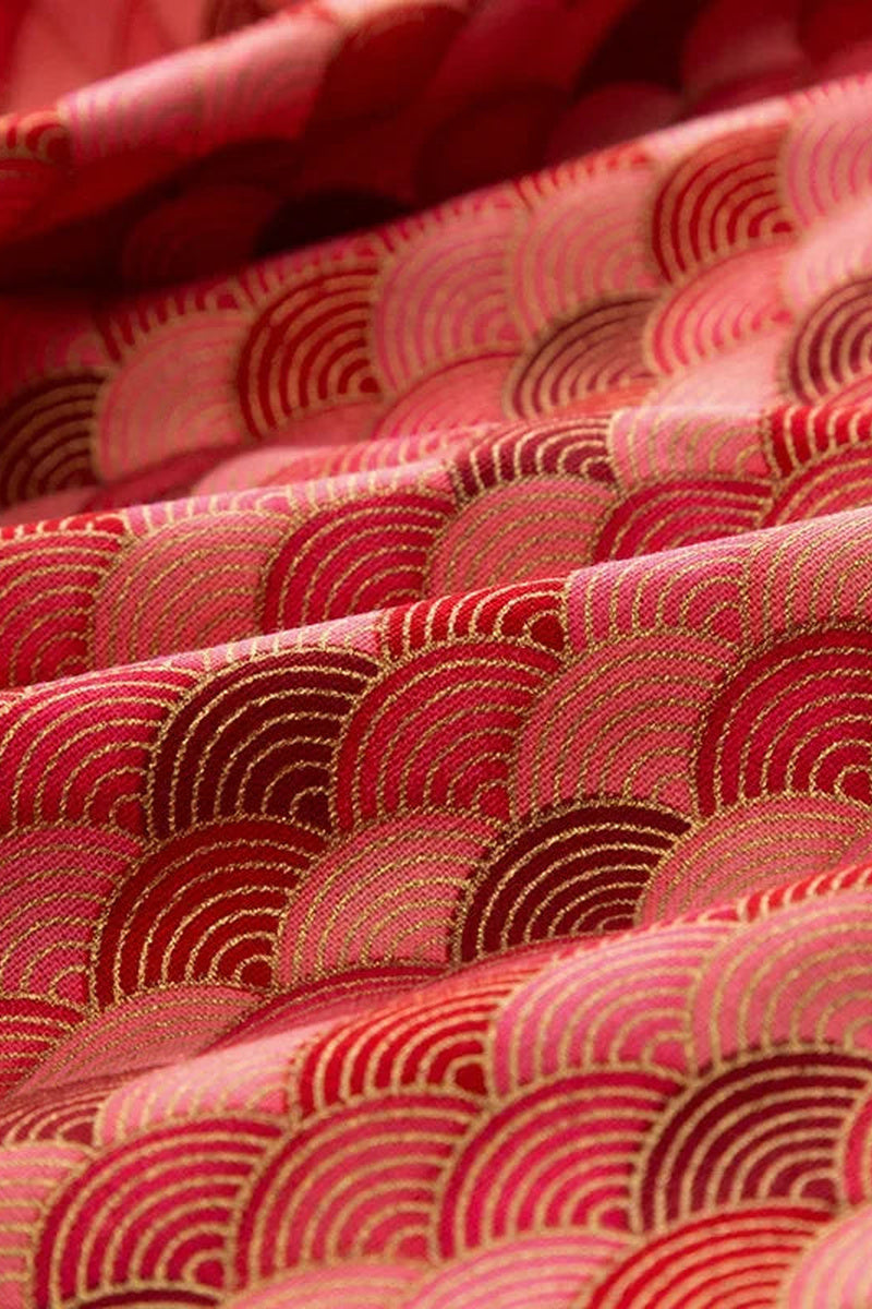Red Seigaiha Furoshiki 'Akanami' – furoshiki printed with seigaiha wave pattern in reds and pink outlined in gold, Japanese furoshiki wrapping cloth 50 by 145 cm, close-up of the print