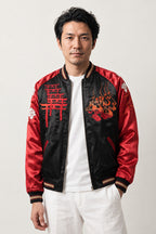 Red Torii Yokai Sukajan 'Hyakki' – black and red sukajan with embroidered red torii gate and yokai, Japanese sukajan souvenir bomber jacket, front view on model