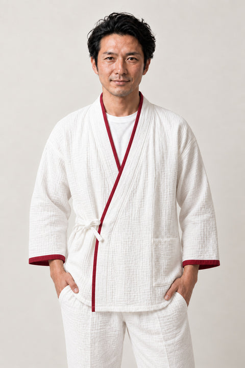 Red Trim Traditional Pajamas 'Beniheri' – white traditional jinbei pyjamas with red trim, unisex two-piece Japanese jinbei set with side-tie top and shorts, front view on model