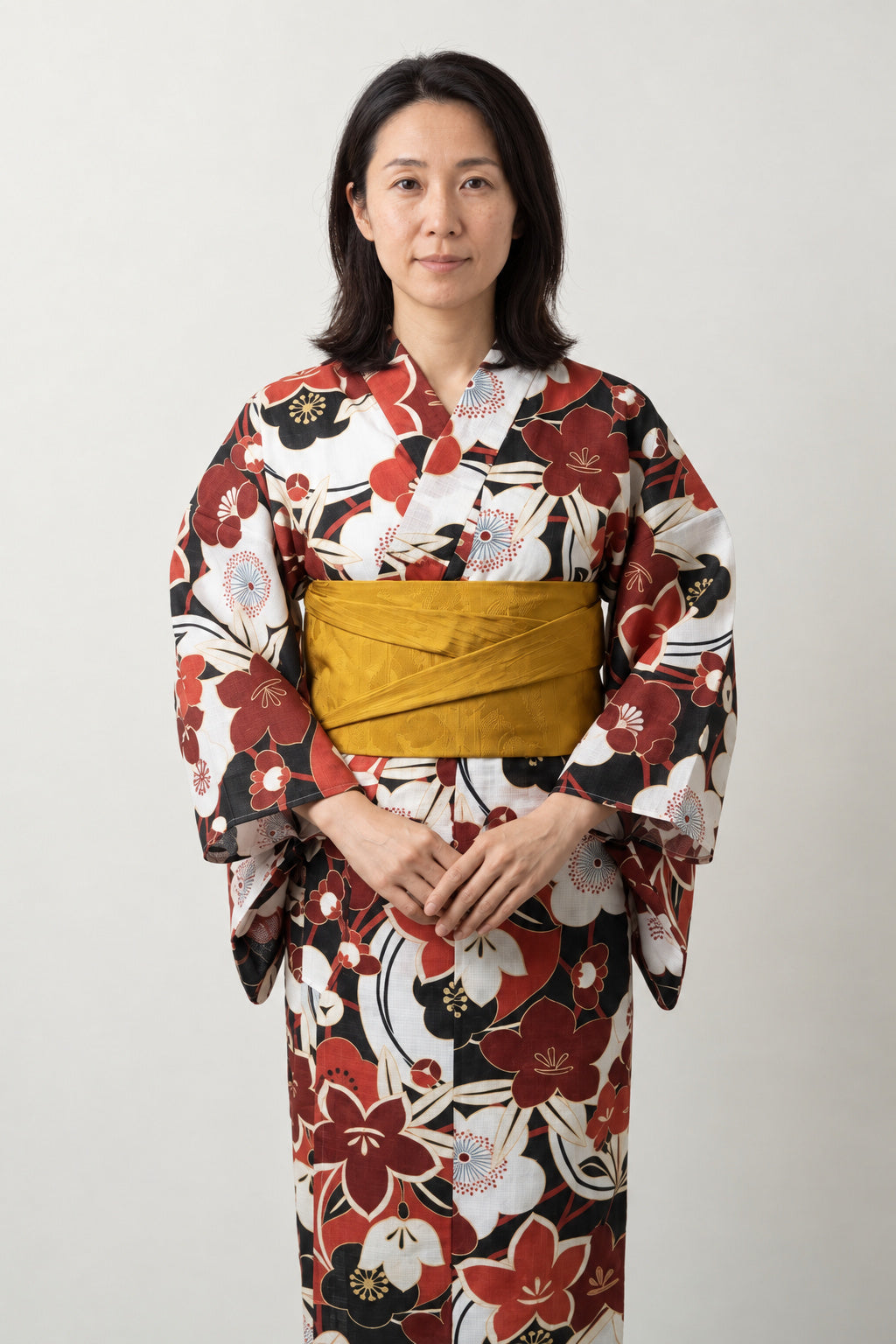 Retro Japanese Kimono 'Kanbai' – cream women's kimono with retro red and brown floral print and mustard obi belt, traditional Japanese yukata, front view on model