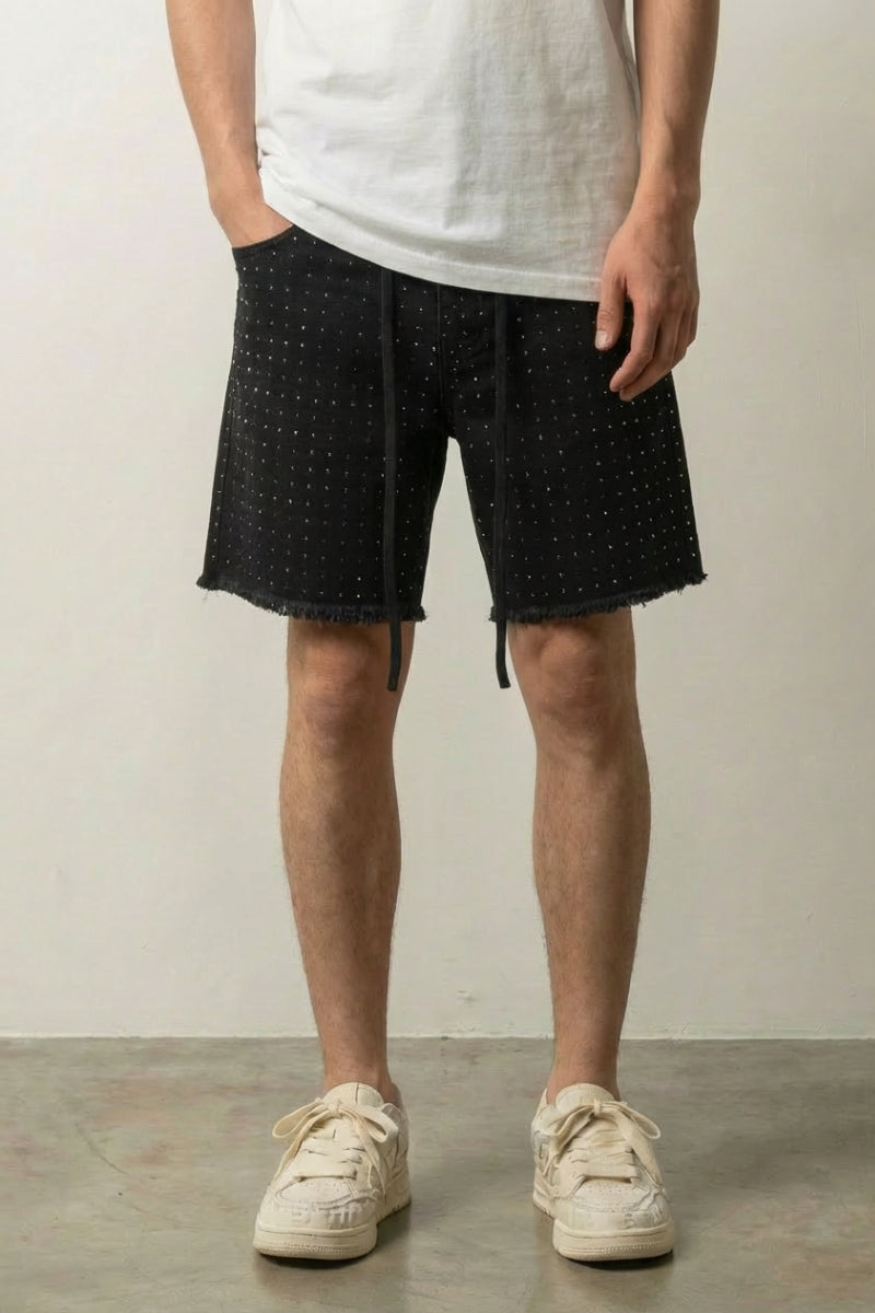 Rhinestone Black Denim Shorts 'Kirameki' – black denim shorts with all-over rhinestones, raw hem and drawstring, front view on model, studio