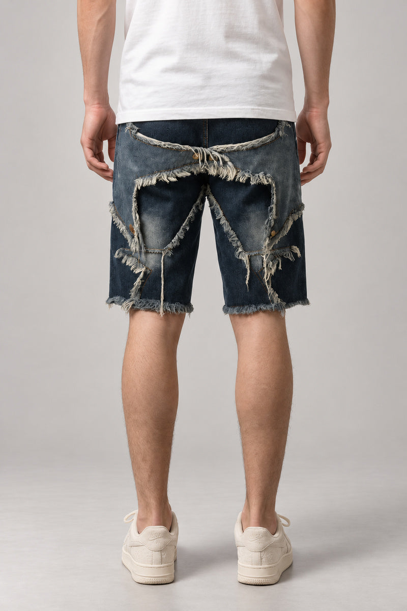 Ripped and Patched Denim Shorts 'Yabure' – back view of the dark blue ripped and patched denim shorts, on model