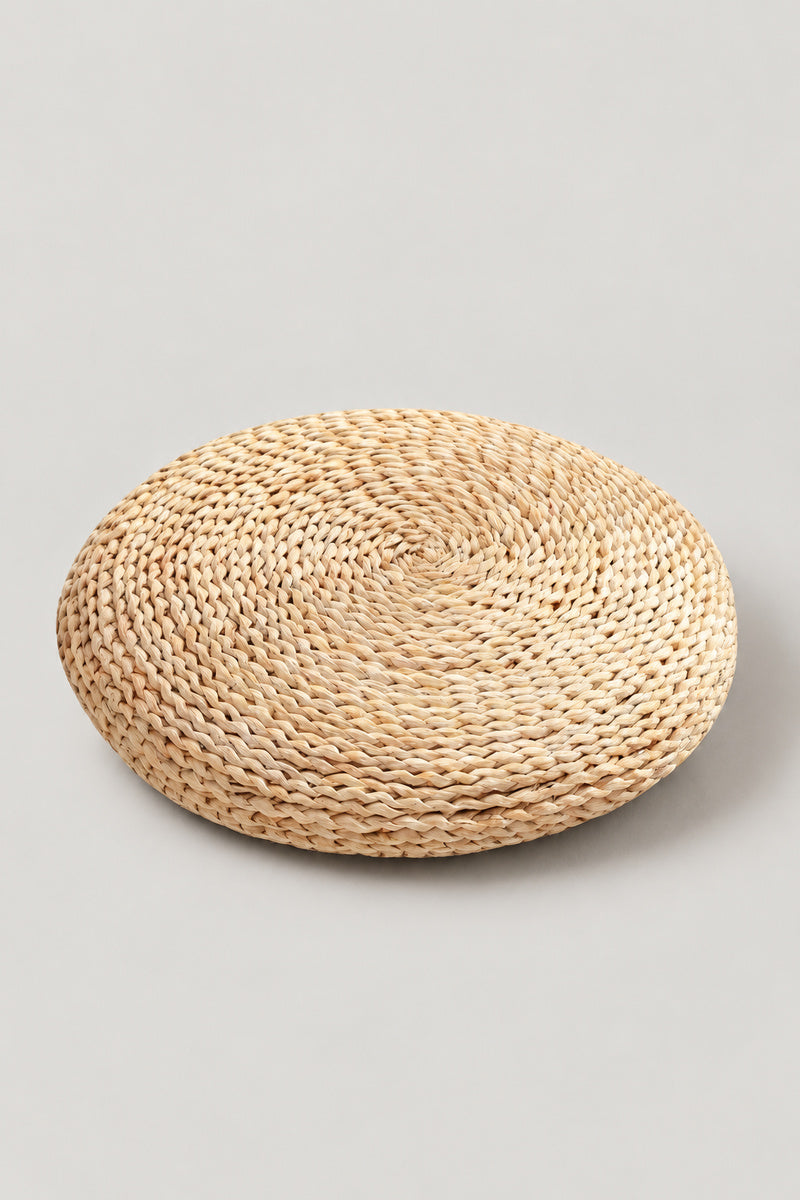 Round Tatami Floor Cushion 'Igusa' – pale natural rush straw round floor cushion woven in a coil, Japanese tatami seat cushion 30 cm, studio view