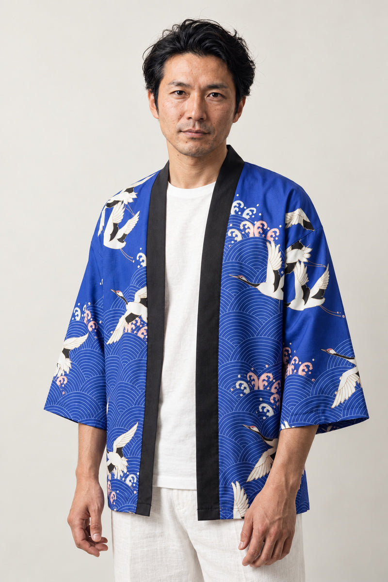 Royal Blue Crane Kimono Jacket 'Gunkaku' – royal blue Japanese kimono jacket with white crane and blossom print, unisex haori cardigan, front view on model