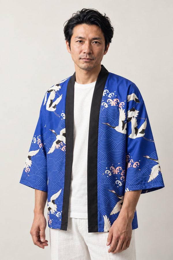 Royal Blue Crane Kimono Jacket 'Gunkaku' – royal blue Japanese kimono jacket with white crane and blossom print, unisex haori cardigan, front view on model