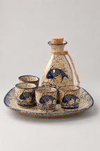 Sake Set 'Tokkuri' – speckled stoneware sake set with corked flask, six cups and round tray painted with blue carp, Japanese sake set, studio view