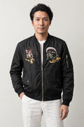 Samurai Streetwear Bomber Jacket 'Kinun' – black bomber jacket with embroidered samurai and dragon patches, Japanese streetwear, front view on model