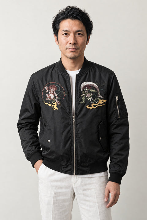 Samurai Streetwear Bomber Jacket 'Kinun' – black bomber jacket with embroidered samurai and dragon patches, Japanese streetwear, front view on model