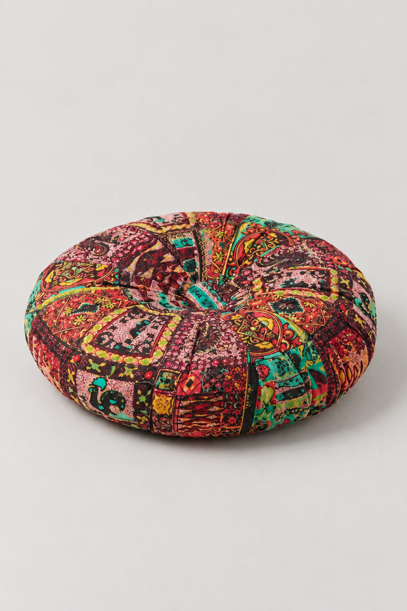 Sashiko Patchwork Round Cushion 'Tsugihagiza' – red segmented round cushion pieced from paisley prints, pumpkin style Japanese patchwork floor cushion, studio view