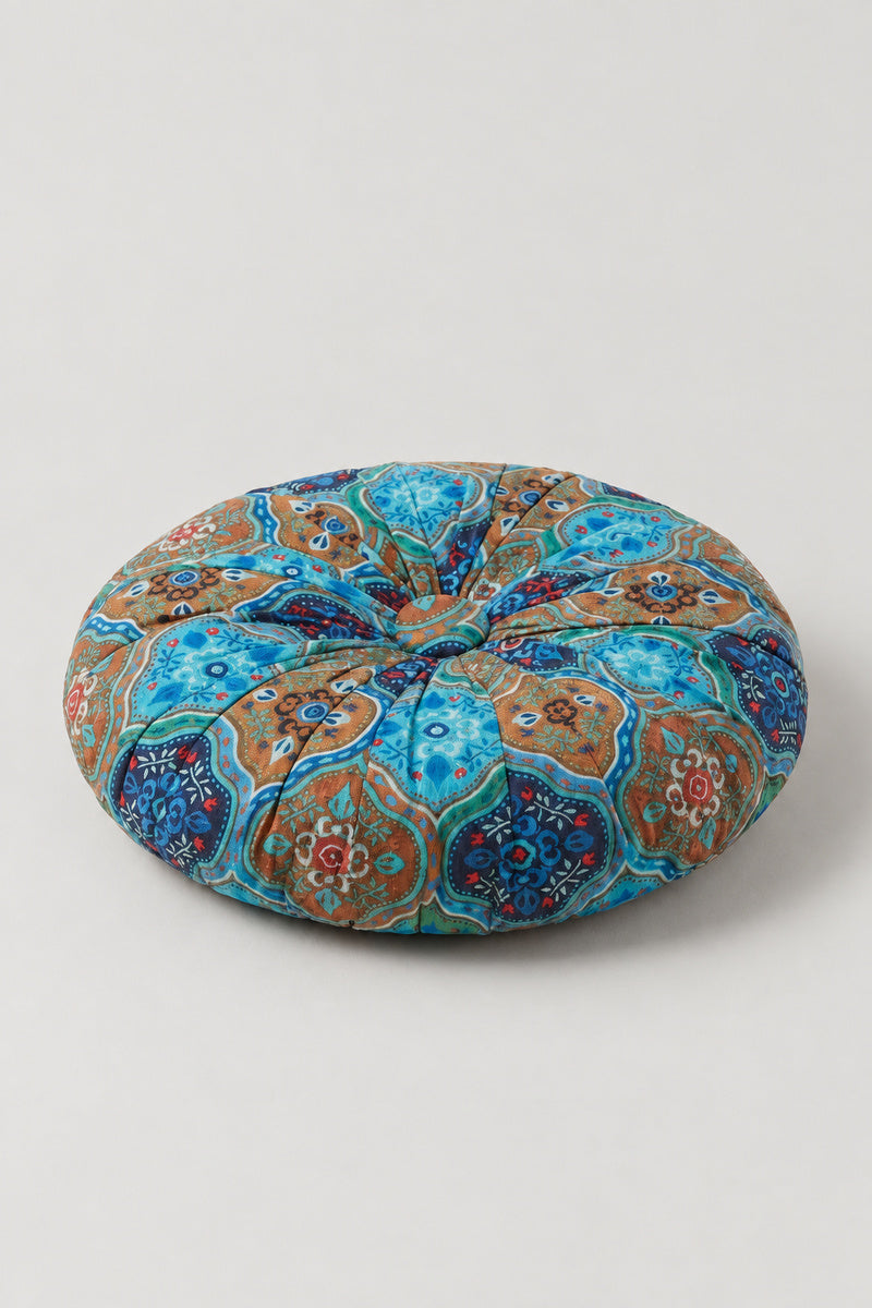 Sashiko Patchwork Round Cushion 'Tsugihagiza' – blue segmented round cushion pieced from patterned prints, pumpkin style Japanese patchwork floor cushion, studio view