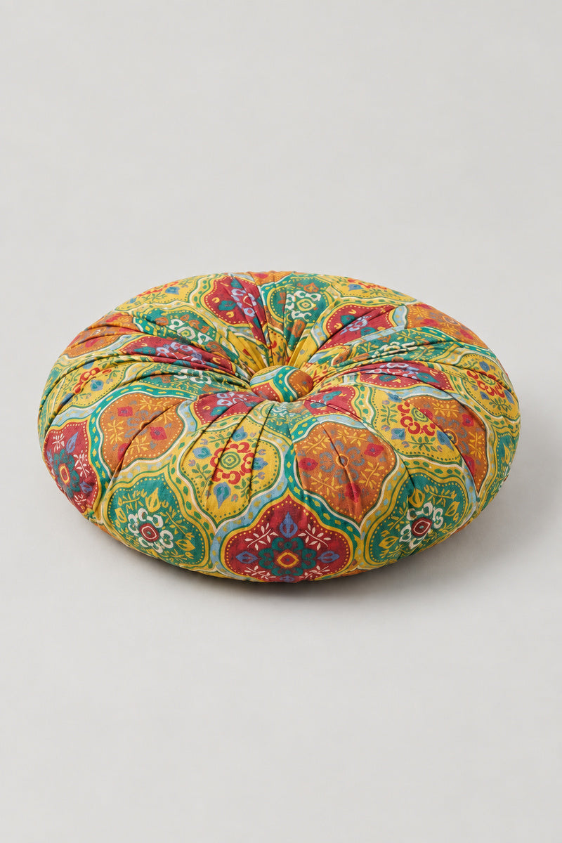 Sashiko Patchwork Round Cushion 'Tsugihagiza' – yellow and green segmented round cushion pieced from patterned prints, pumpkin style Japanese patchwork floor cushion, studio view