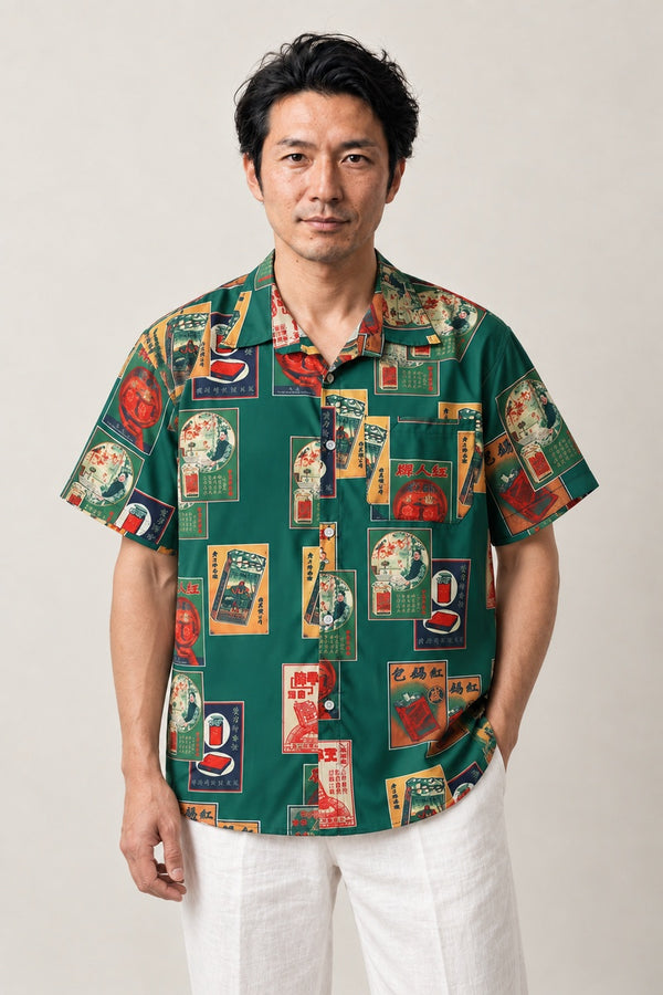 Showa Retro Label Print Shirt 'Harigami' – green short sleeve shirt with Showa retro Japanese label print, Japanese streetwear camp collar shirt, front view on model