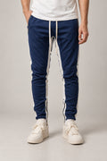 Side Stripe Track Pants 'Hashiri' – navy slim track pants with white side stripe and drawstring, Japanese streetwear trousers, front view on model