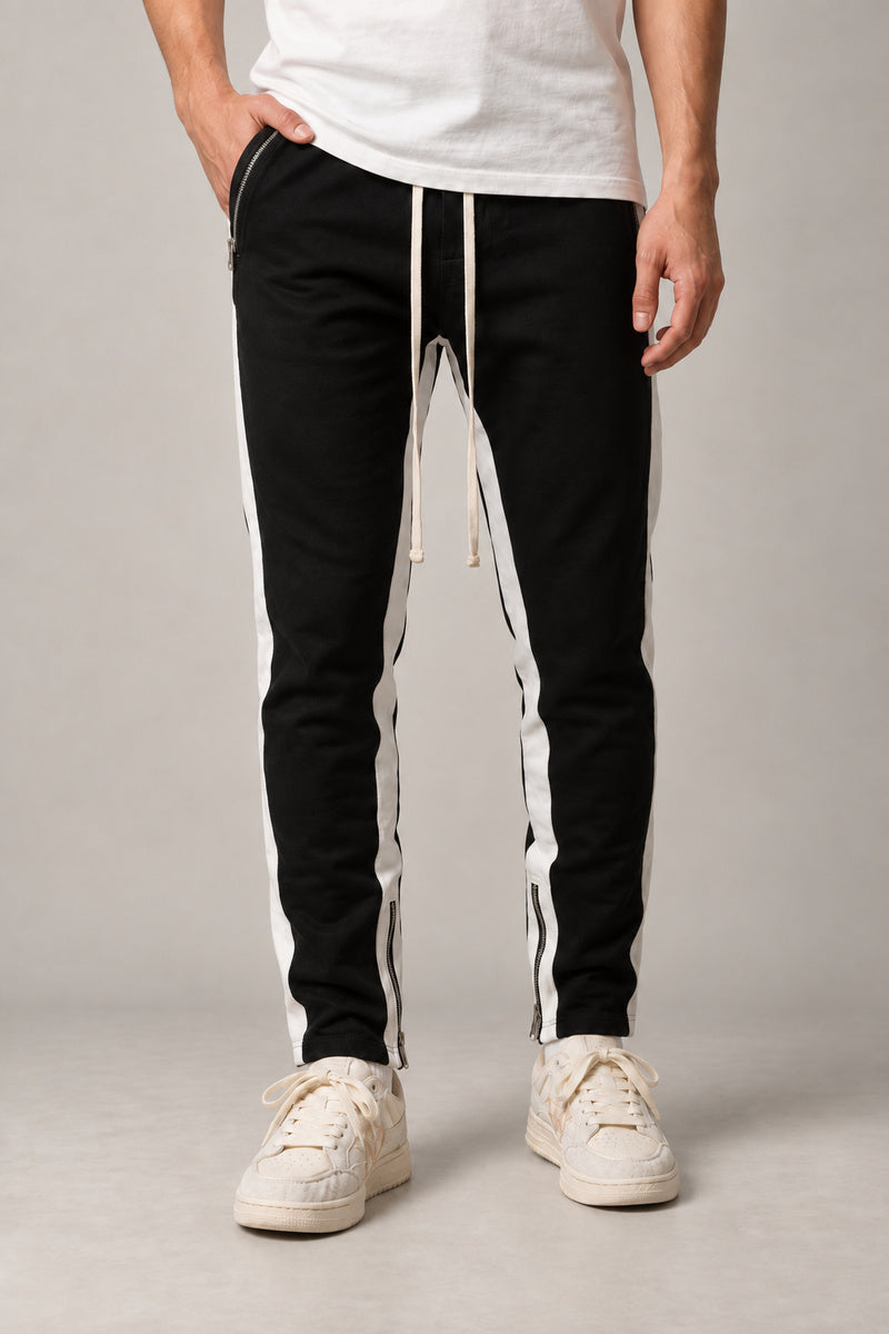 Side Stripe Track Pants 'Hashiri' – black version of the side stripe track pants with white stripe, front view on model
