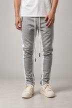 Side Stripe Track Pants 'Hashiri' – grey side stripe track pants with white piping, front view on model