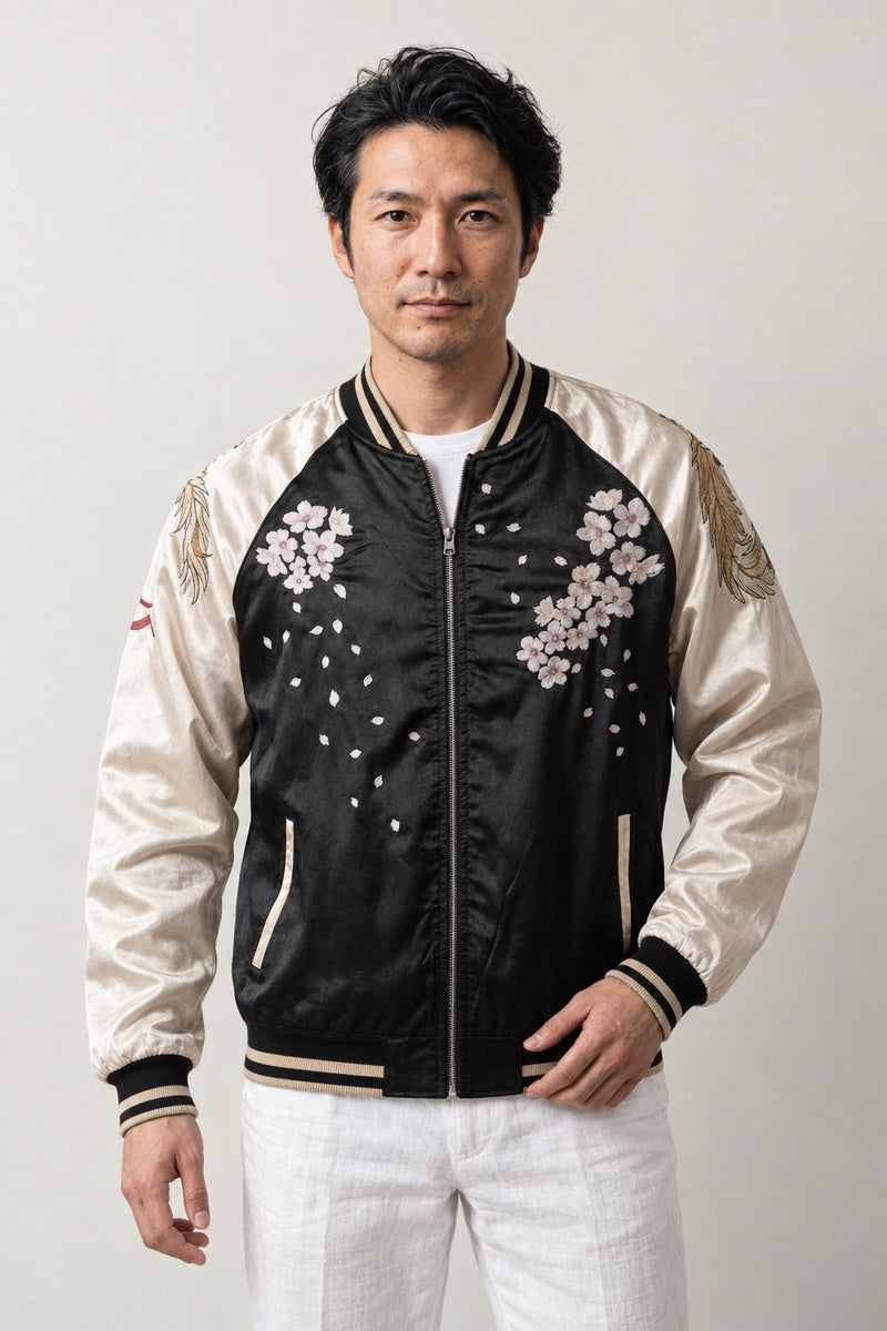 Silver Phoenix Sukajan 'Otori' – black and cream sukajan with embroidered cherry blossom and phoenix, Japanese sukajan souvenir bomber jacket, front view on model