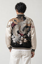 Silver Phoenix Sukajan 'Otori' – back view of black and cream sukajan showing the silver embroidered phoenix and blossom
